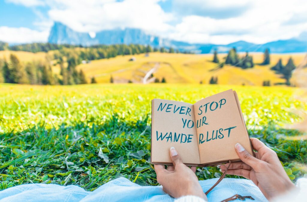 Woman holding message about travelling and wanderlust