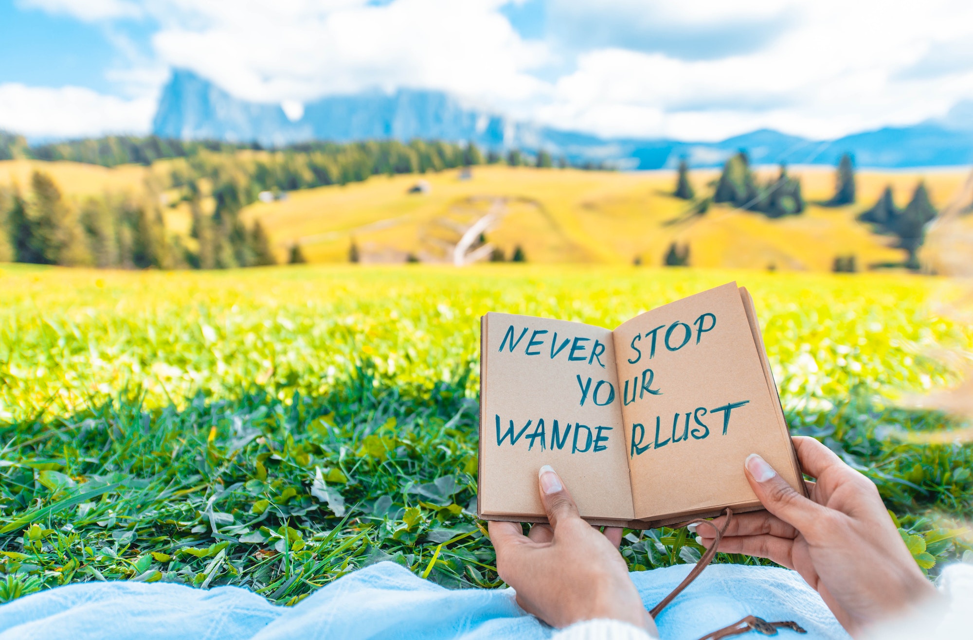 Woman holding message about travelling and wanderlust